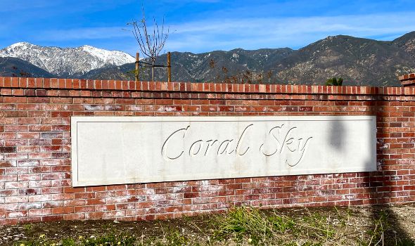 Brick wall with white Coral Sky signage | homes for sale in coral sky rancho cucamonga | Alvin Tapia