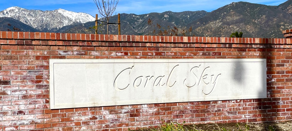 Brick wall with white Coral Sky signage-Homes For Sale in Coral Sky Rancho Cucamonga-Featured Image-Alvin Tapia
