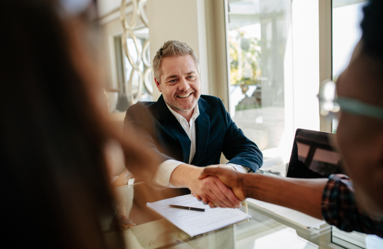 Realtor hand shaking with clients | Can Property Be Transferred Without Probate in California